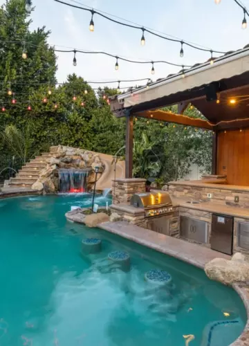 Backyard pool with grill in rehab | New Breath Recovery