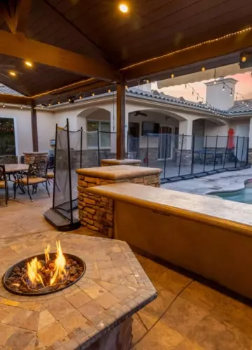 Patio with fire pit and outdoor dining space | New Breath Recovery